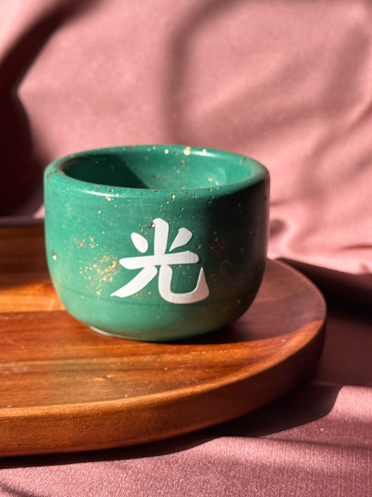 Vela verde e brilho